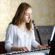 Image of person playing piano